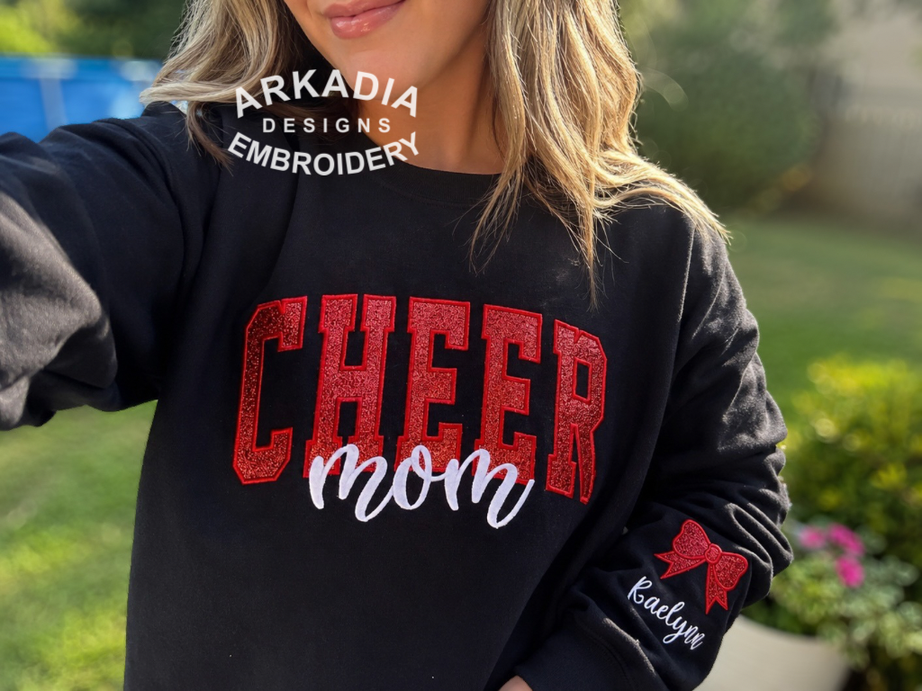 Personalized Embroidered Cheer Mom Sweatshirt, Team Spirit Crewneck, Cheer Mama Bow Shirt with Kids Name on Sleeve, Cheer Shirt Gift for Her